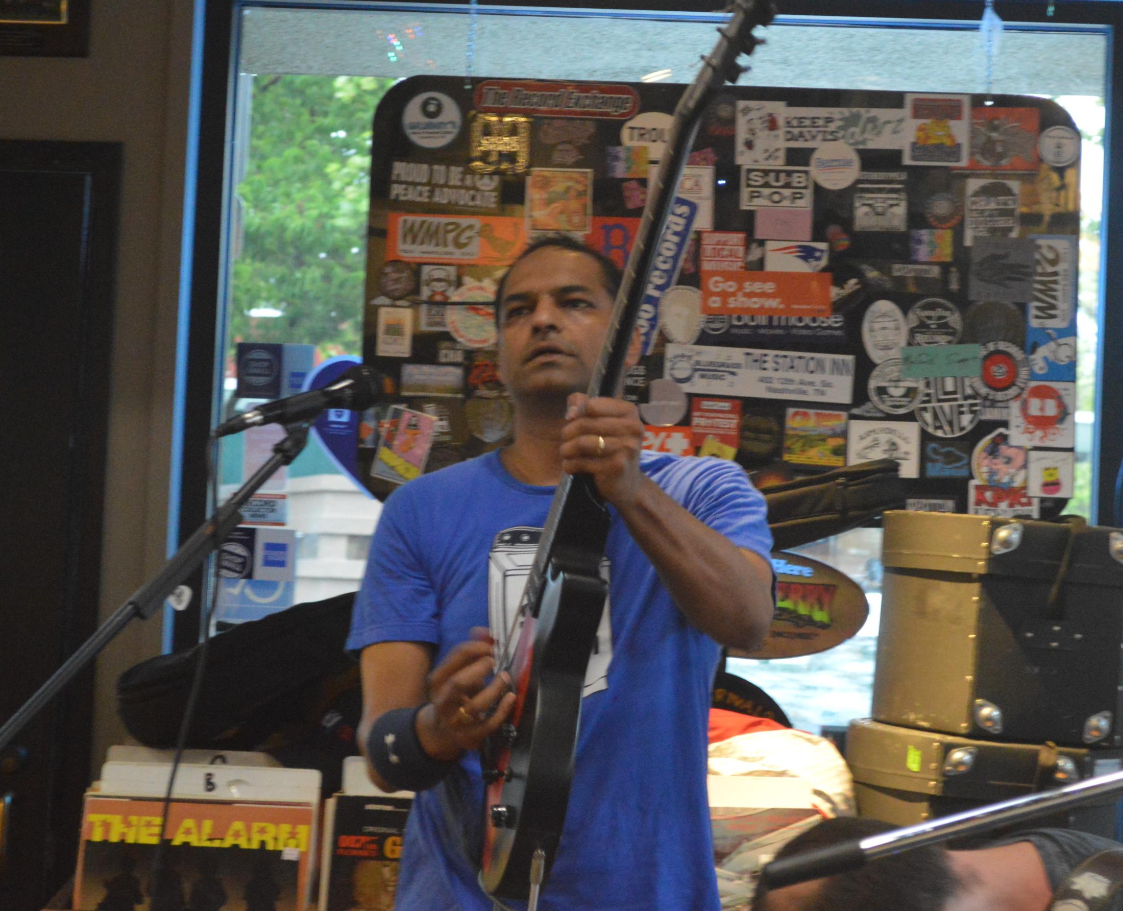 Charan Ranganath plays guitar