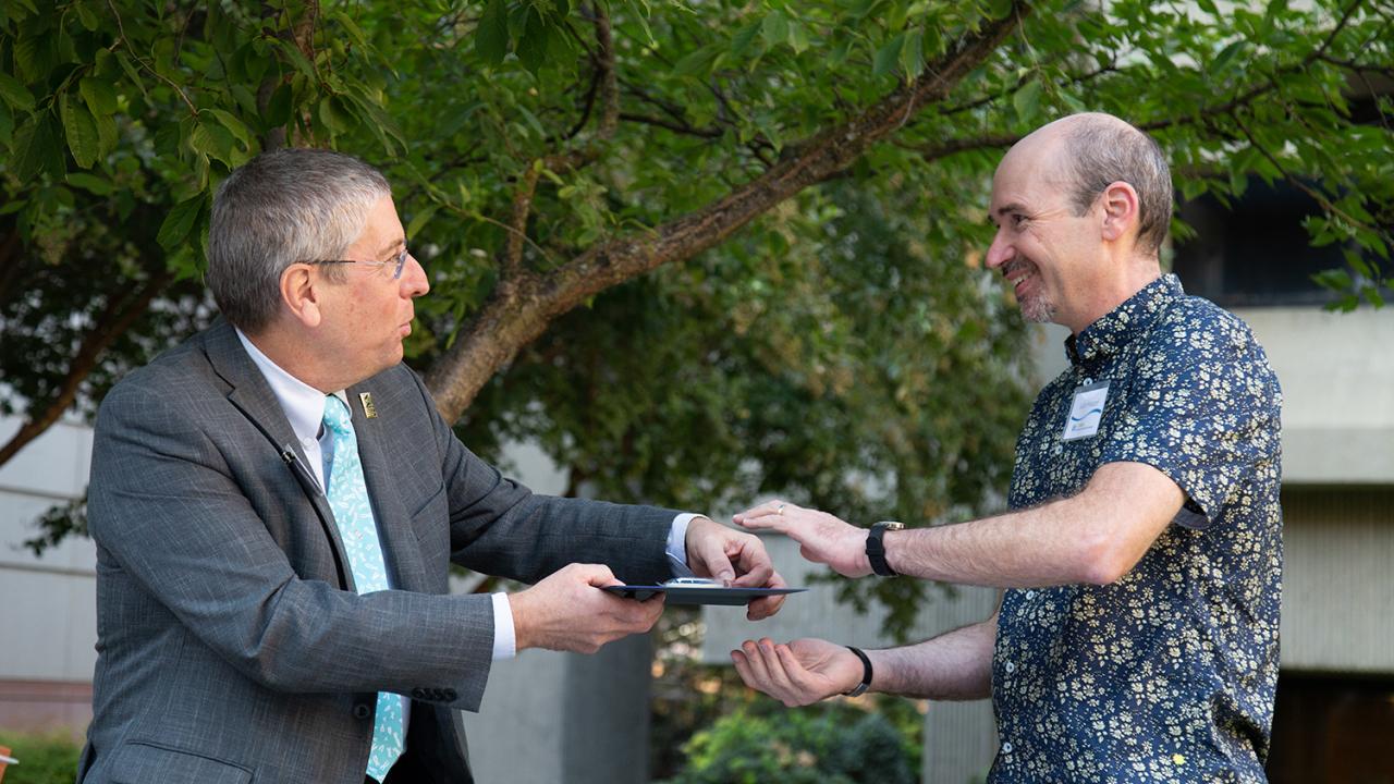 College of Biological Sciences Dean Mark Winey gives the Faculty Teaching Award to Professor Julin Maloof, Department of Plant Biology. Greg Watry/UC Davis Mark Winey and Julin Maloof