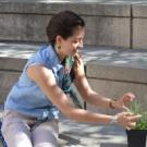 Jenna Gallegos with an Arabidopsis thaliana plant. Sometimes called “thale cress,” Arabidopsis is a popular plant for laboratory studies.